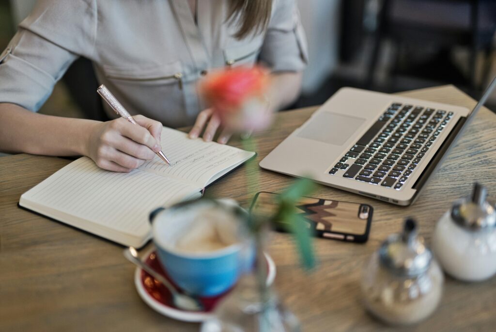 Blogger writing blog on her desk